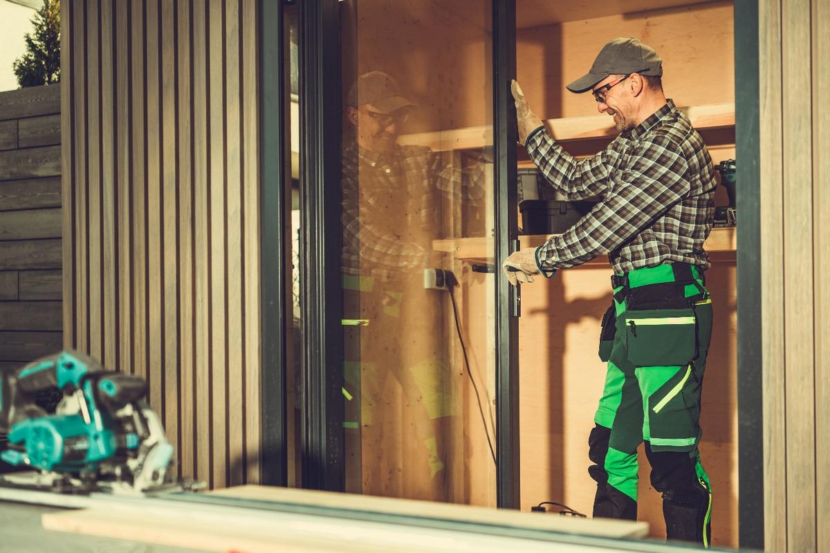 Technician replacing sliding glass door rollers in Fort Lauderdale